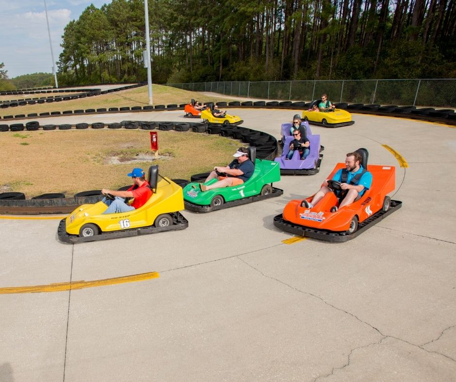 kids racing go karts around a track