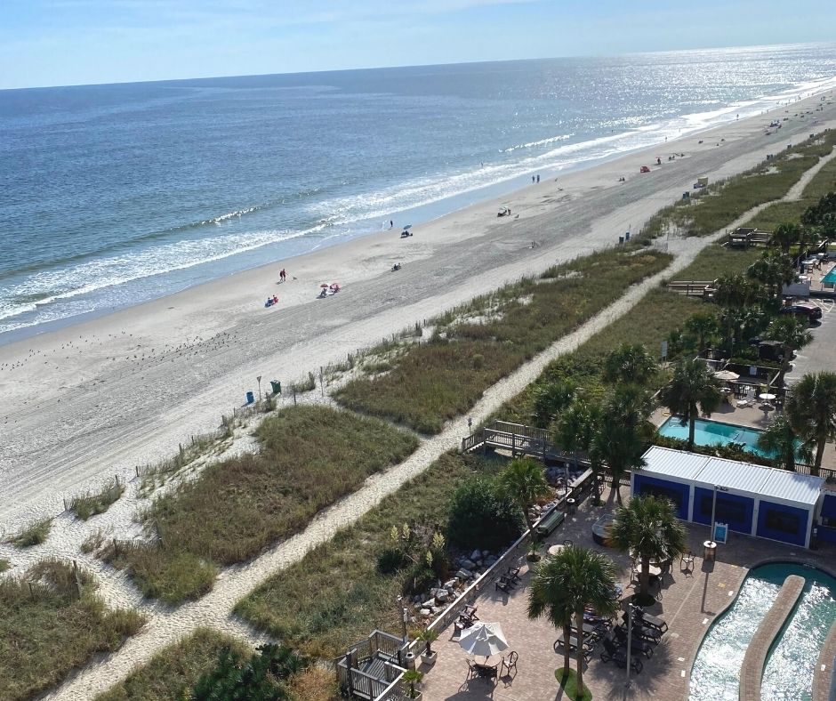 Balcony view of ocean and pool deck from Caribbean Resort