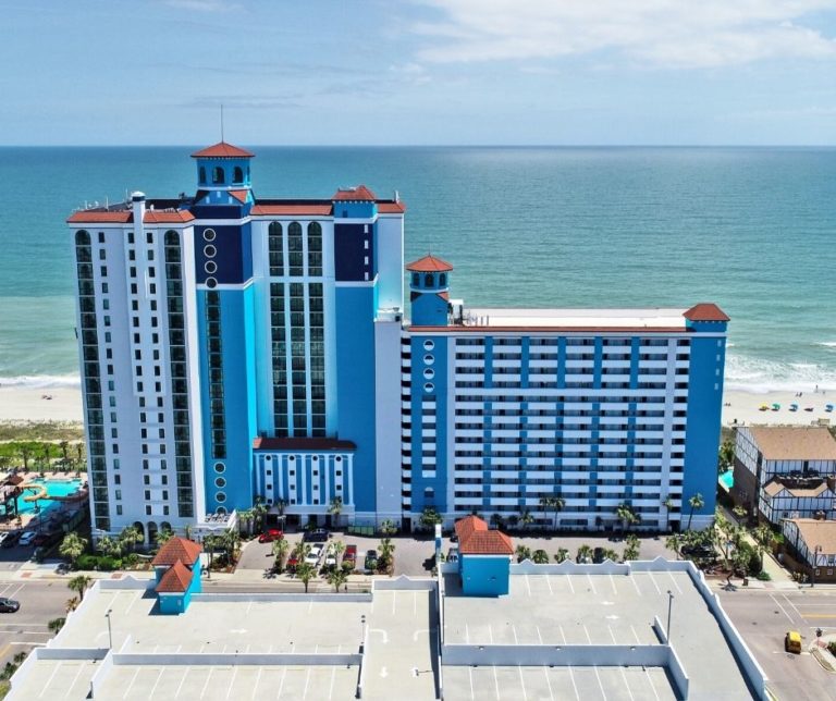 Drone photo of the front of Caribbean Resort with ocean in background