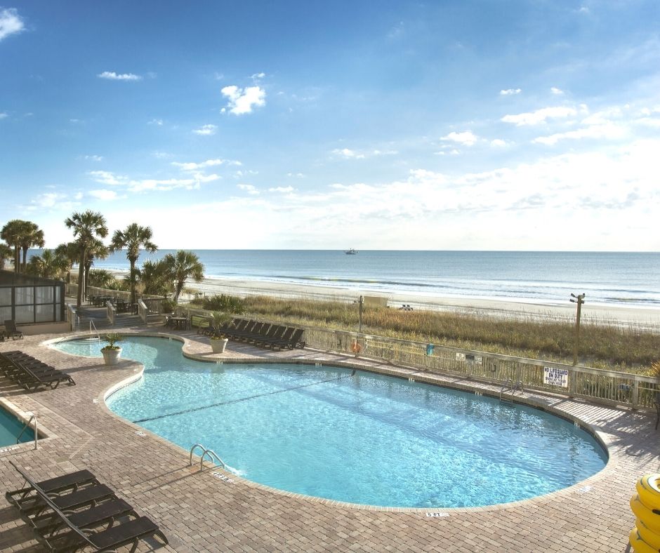 Oceanfront outdoor pool with view of ocean