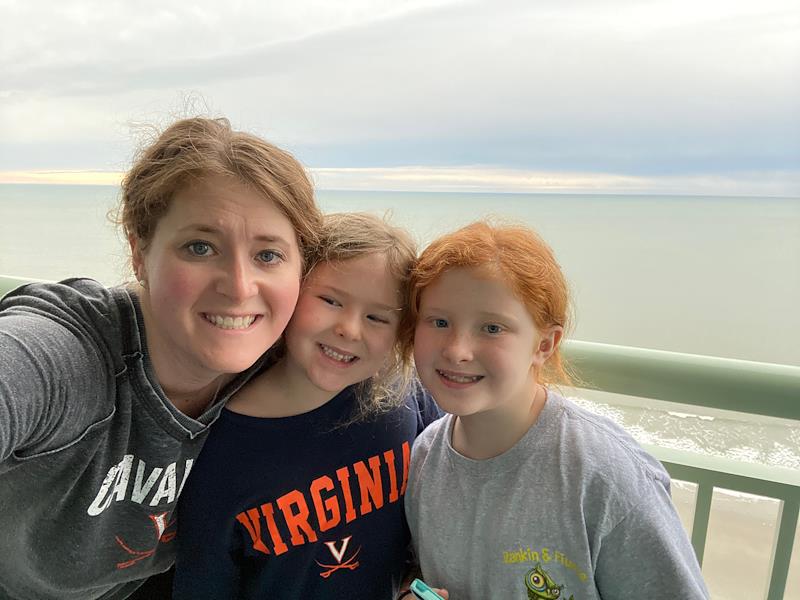 mom and daughters on balcony