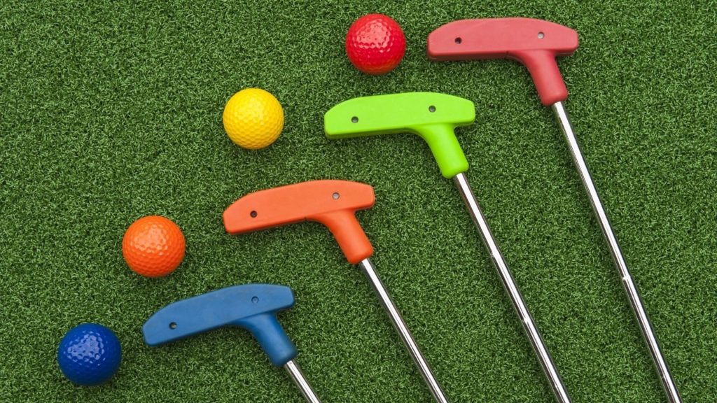 Putters and colored golf balls