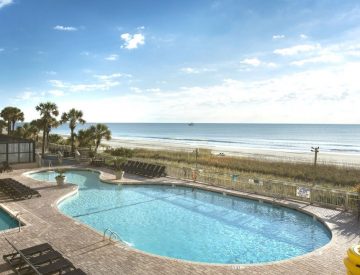 Oceanfront outdoor pool with view of ocean